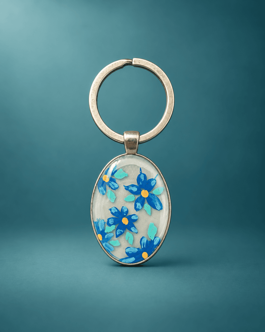 Blue floral acrylic and resin metal keychain